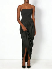 Black strapless dress with draped design on a white background