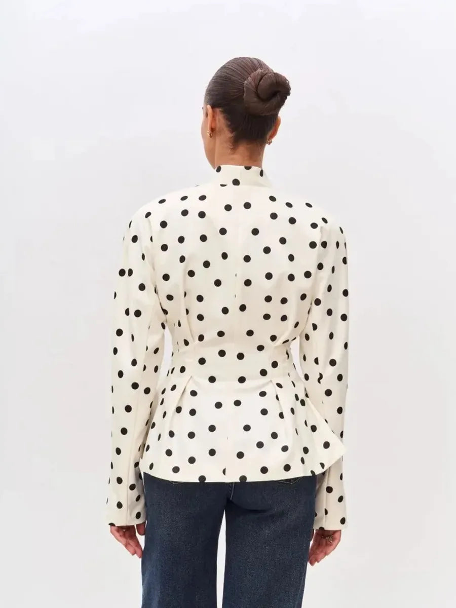 Back view of polka dot peplum blazer