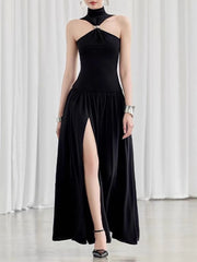 Black halter neck dress with a high slit 