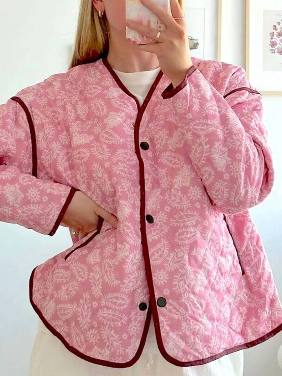 Quilted jacket with pink paisley print, showing front buttons