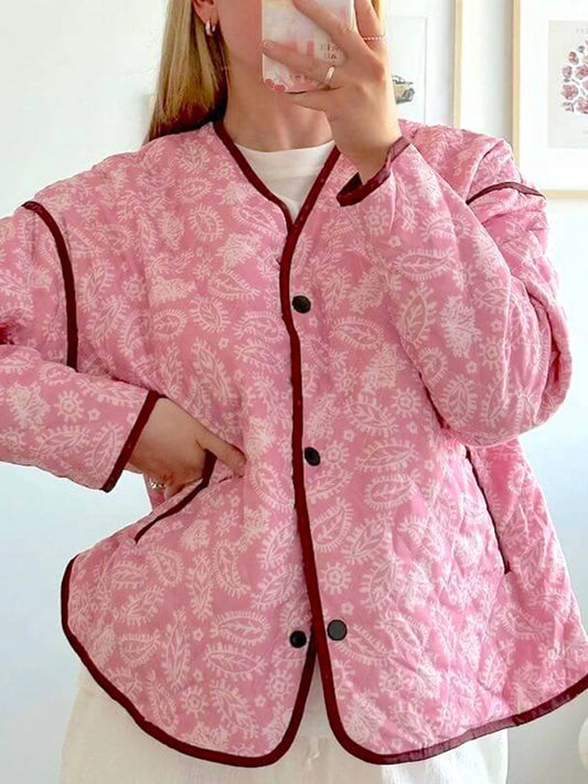 Quilted jacket with pink paisley print, showing front buttons