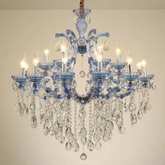 Elegant chandelier with crystal pendants and candle lights.