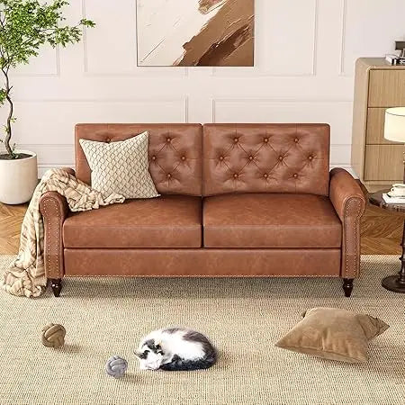 Brown leather sofa in a living room with a cat and toys on the floor.