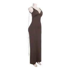 Brown evening gown on a mannequin against a white background