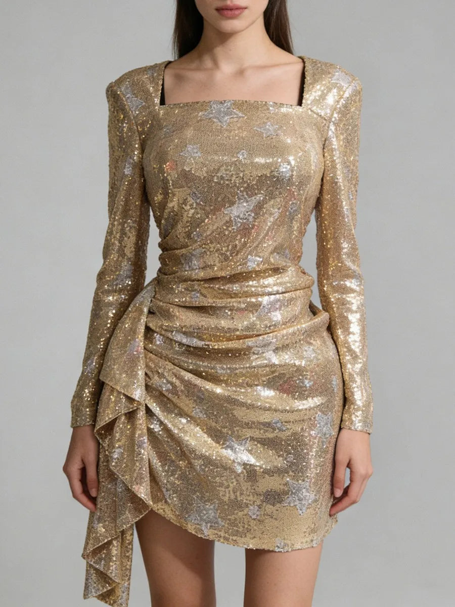 Gold sequin dress with long sleeves on a plain background