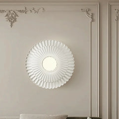 A round French retro wall sconce with a milk white glass lampshade, casting a soft glow on a bedside table. C