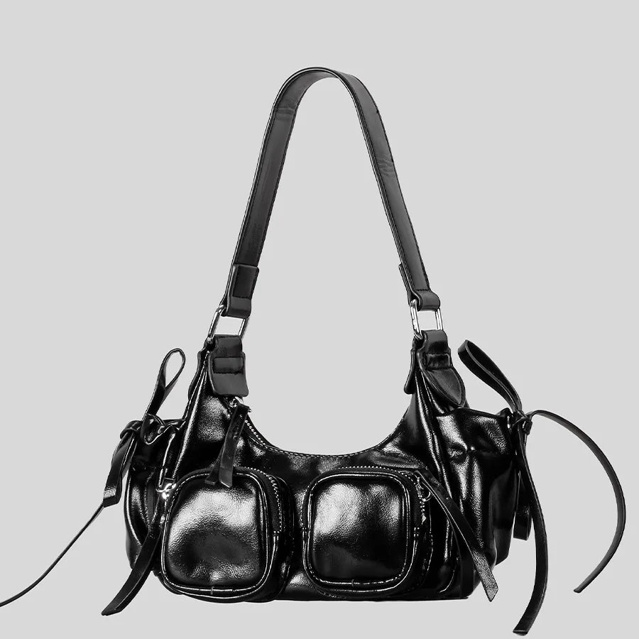 soft structured black shoulder bag with external zippers
