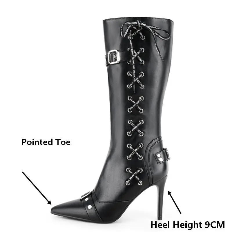 Close-up of pointed toe on black faux leather stiletto boots