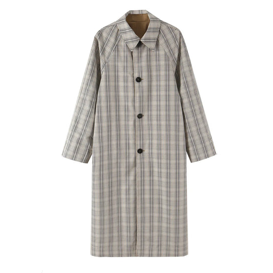 Reversible coat in plaid pattern with lapel collar and button closure.