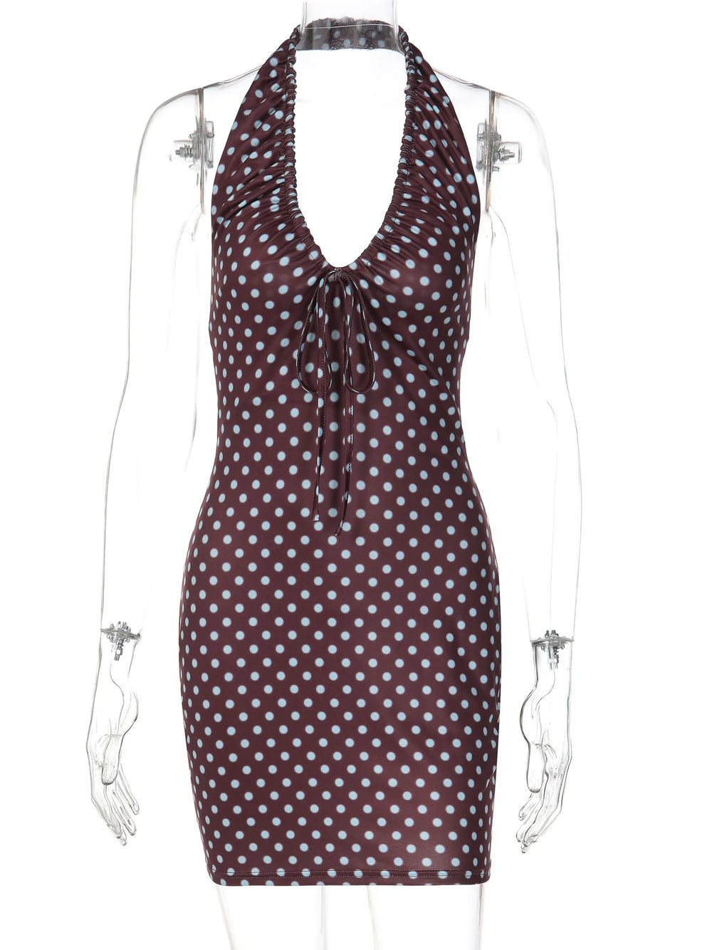 Polka dot halter neck dress on a mannequin against a white background