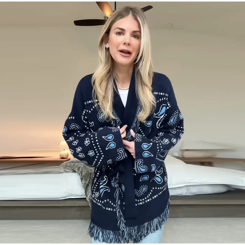 Woman wearing a navy blue patterned scarf indoors