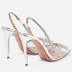 Crystal transparent pumps featuring thin heels for a sleek look.