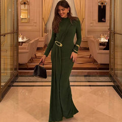 Green long sleeve draped maxi dress with metal buckle detail.