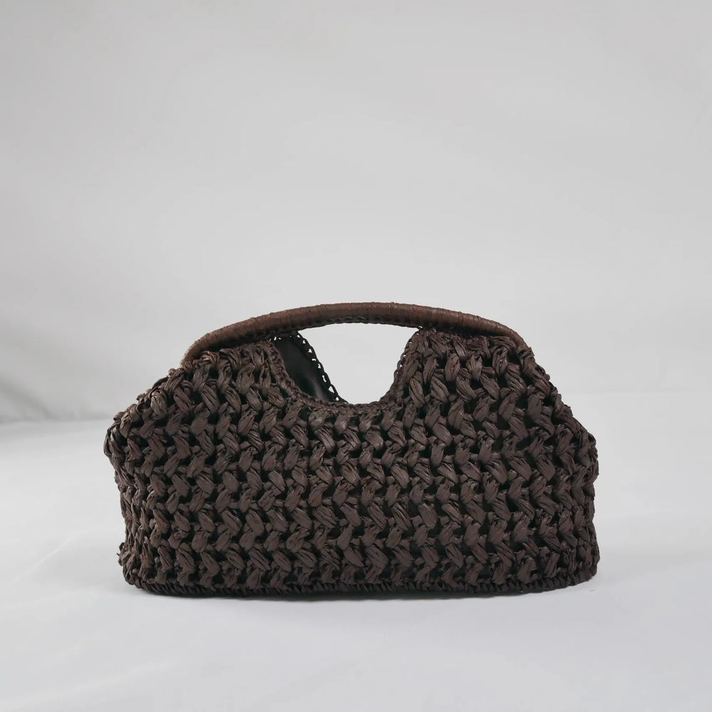 Brown woven handbag on a light gray background