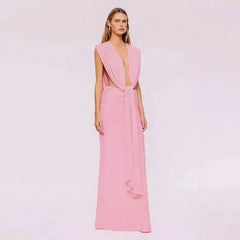 Model wearing a pink draped plunge neckline maxi dress.