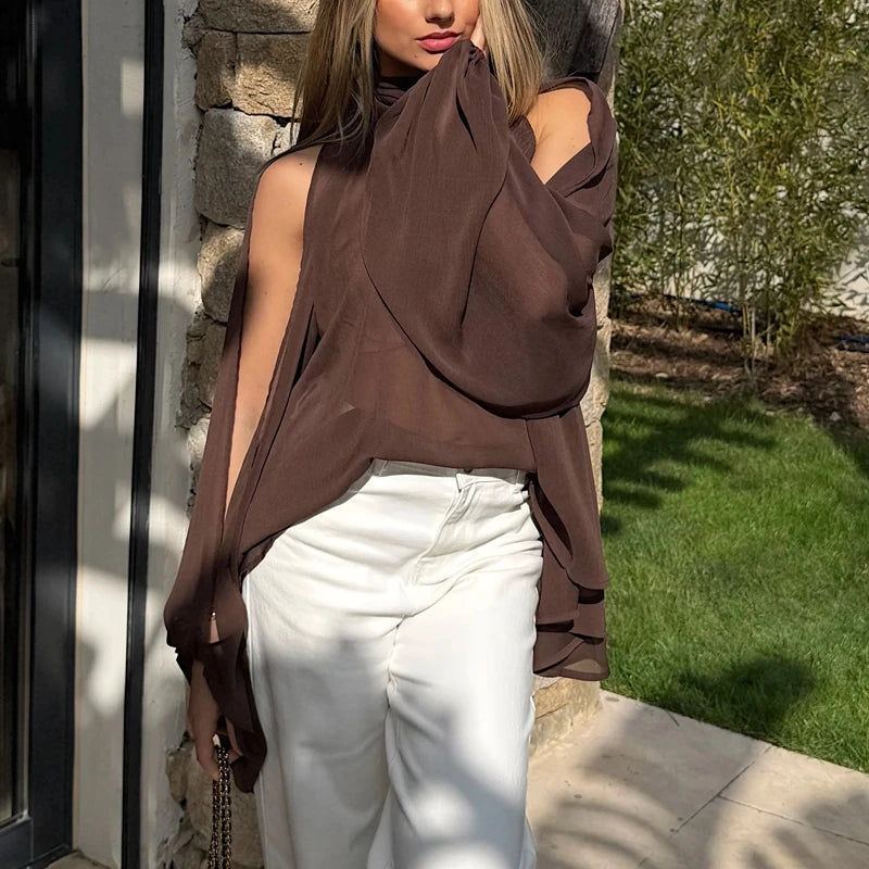 Close-up detail of the mock neck split sleeve chiffon cape top