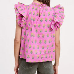 Pink floral blouse with ruffled sleeves on a plain background