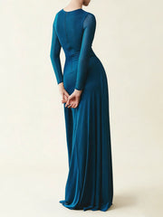 Teal evening gown with long sleeves on a white background