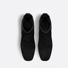 Top view of black suede ankle boots