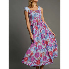 Light blue floral print smocked square neck maxi dress with light blue tie shoulder straps.