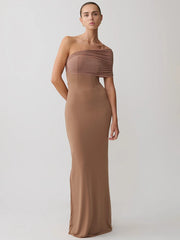 Woman wearing a brown strapless gown on a white background