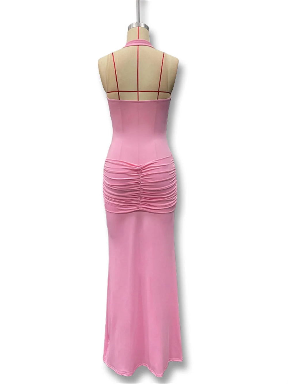 Pink evening gown on a mannequin against a white background