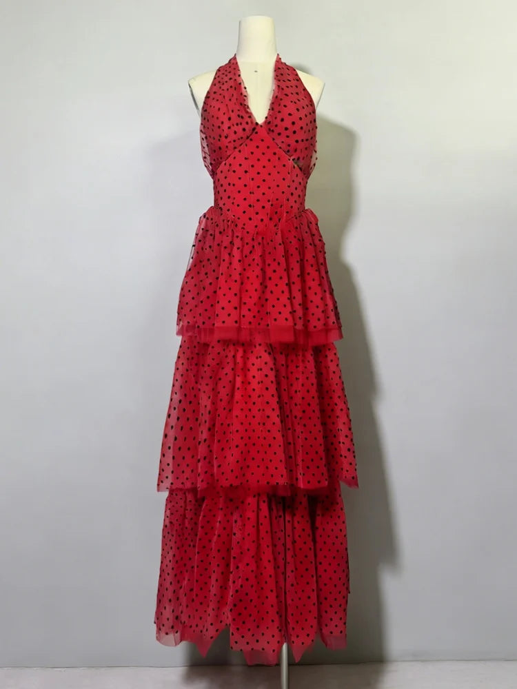 Red polka dot dress on a mannequin against a white background