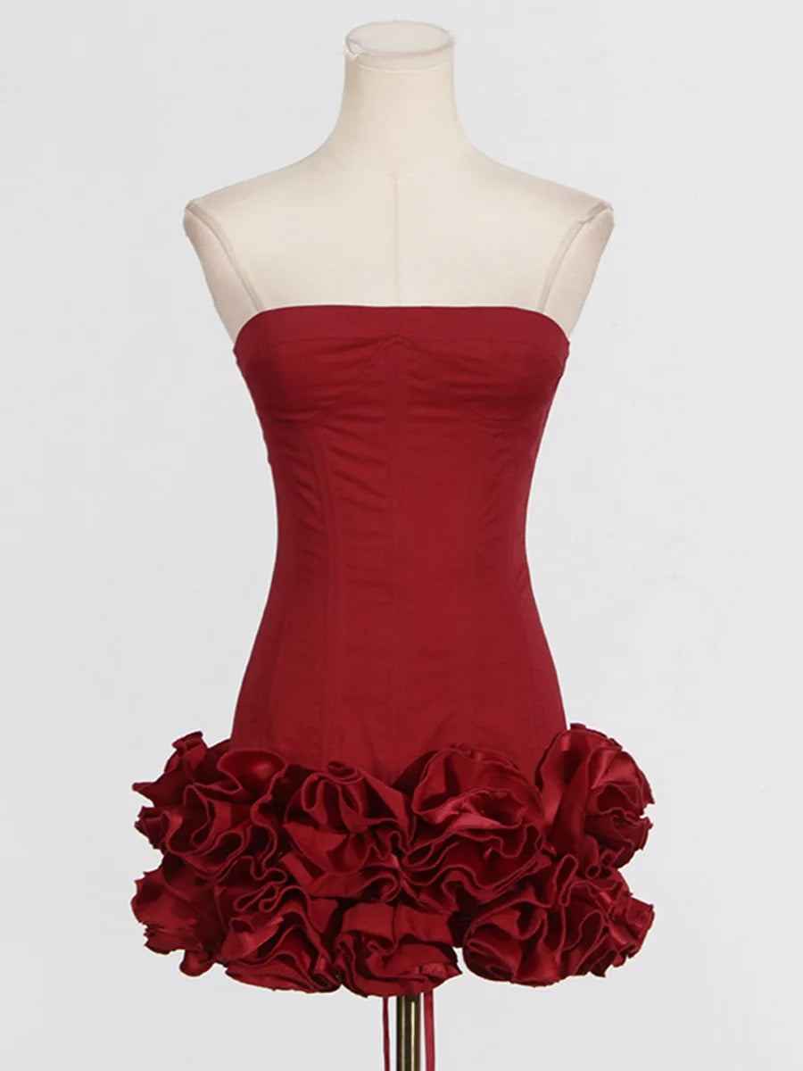 Red strapless dress with ruffled skirt on a mannequin against a white background