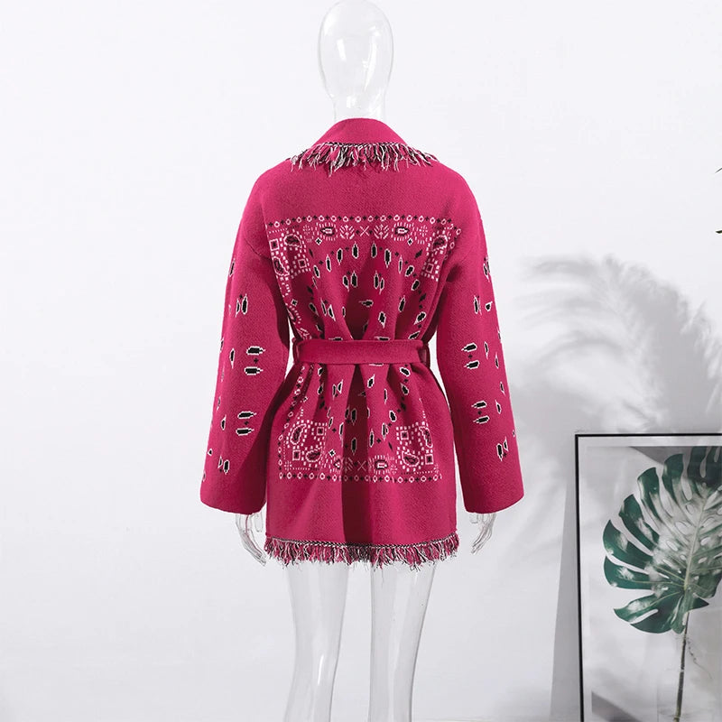 Pink jacket with bandana pattern on a mannequin against a white background