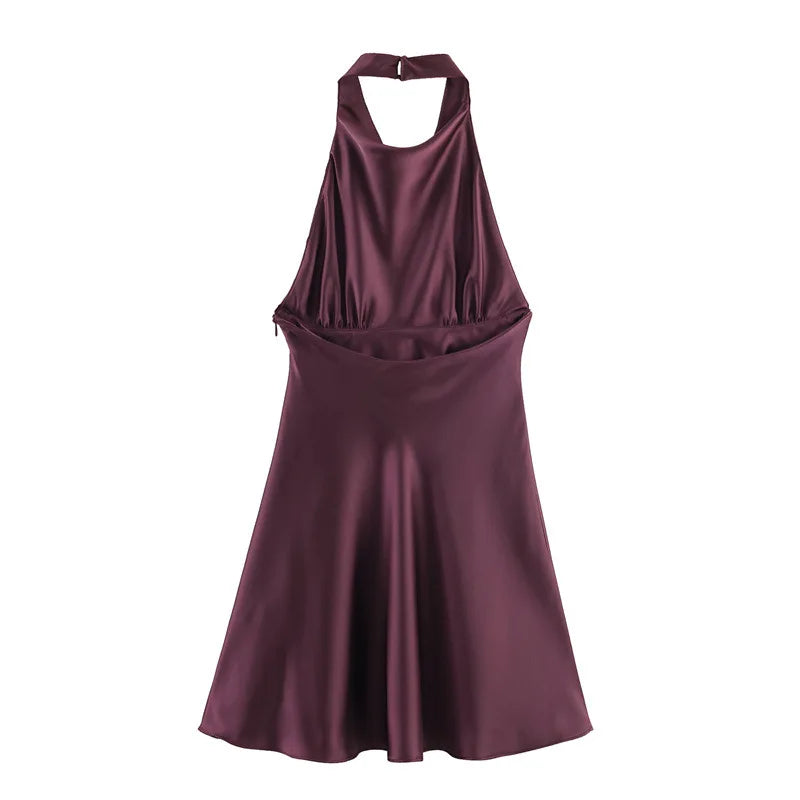 Purple halter neck dress on a white background