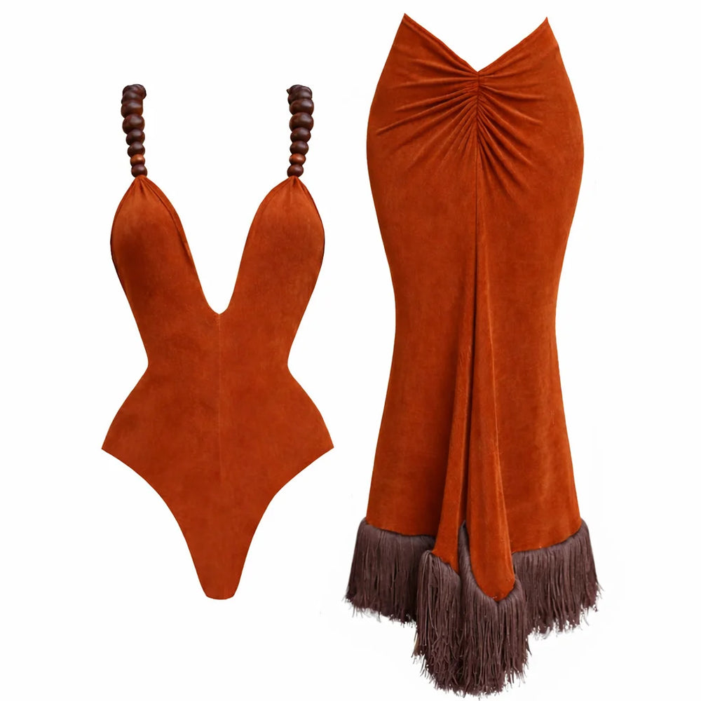 Orange suede swimsuit with matching skirt on a white background