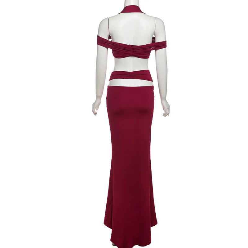 Red evening gown on a mannequin against a white background