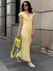 Yellow ruffled knit maxi dress with a V-neck.
