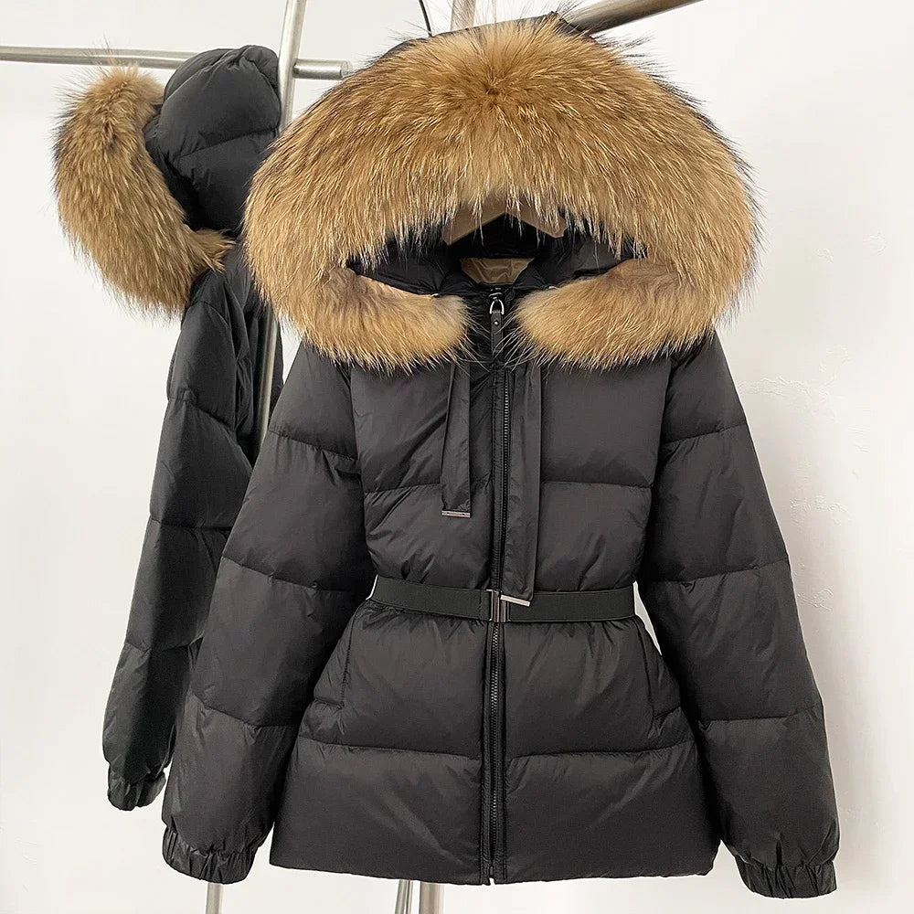 Black puffer jacket with fur hood on a white background