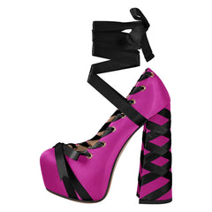Pink high-heeled shoe with black ribbons on a white background