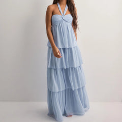 Light blue tiered dress on a plain background