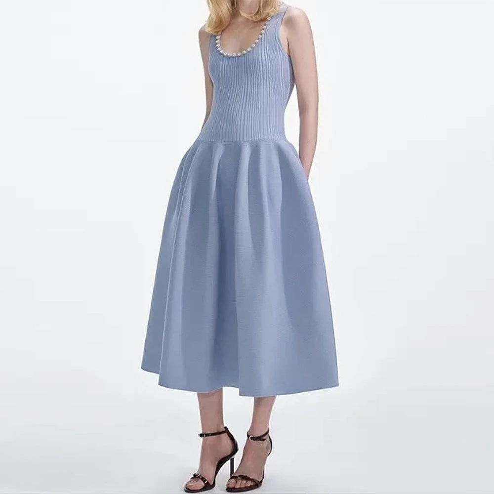 Light blue dress worn by a model on a white background
