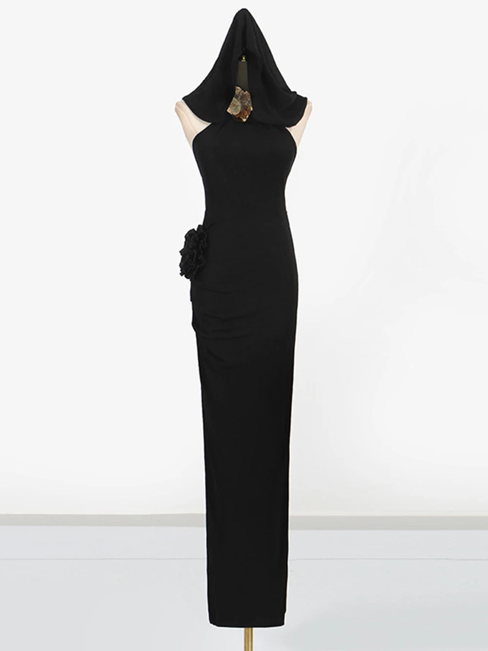 Black evening gown with floral details on a white background