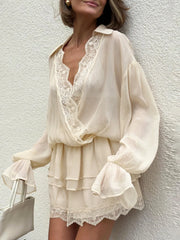 Beige mini dress with cross neck and lace trim