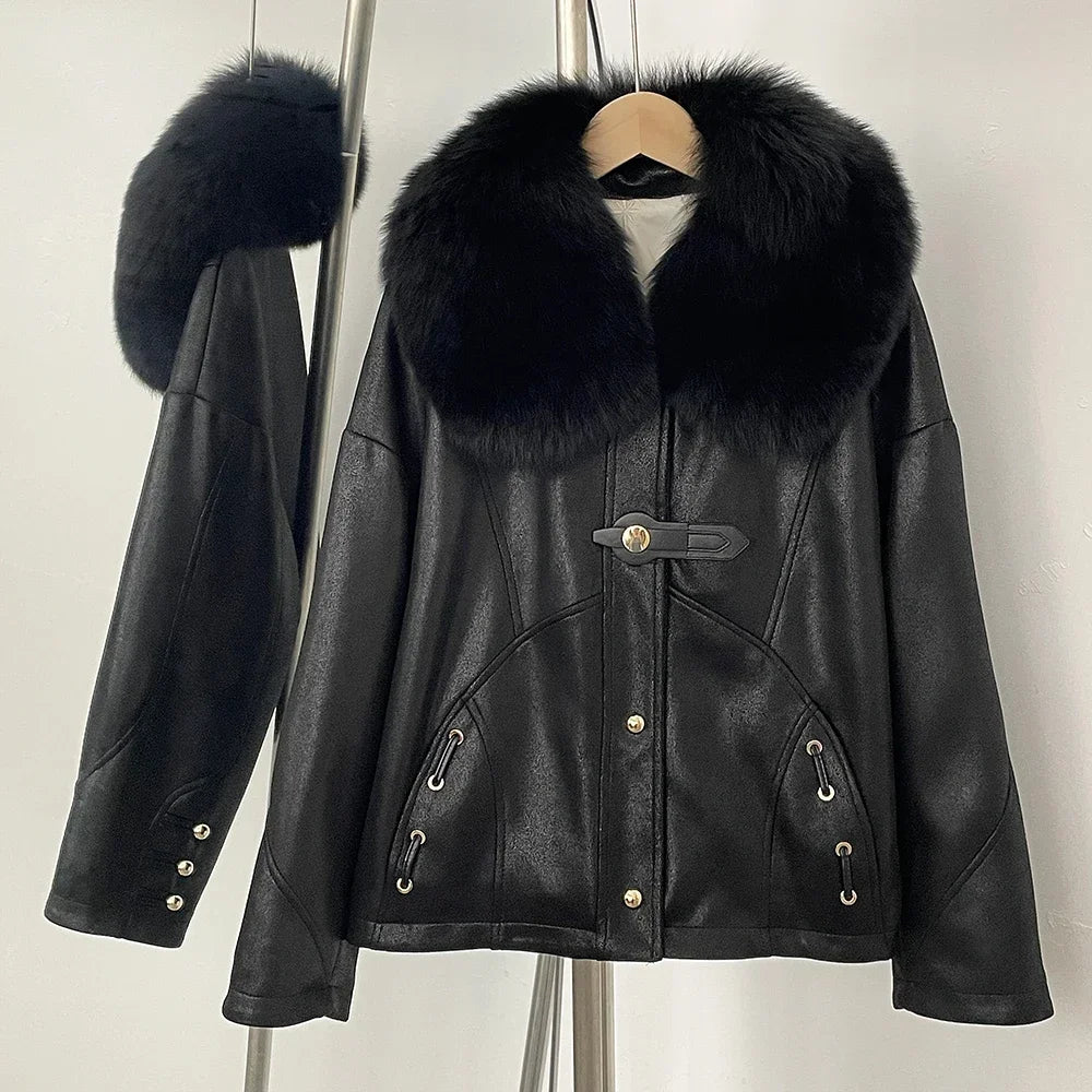 Black leather jacket with fur collar on a mannequin against a white background