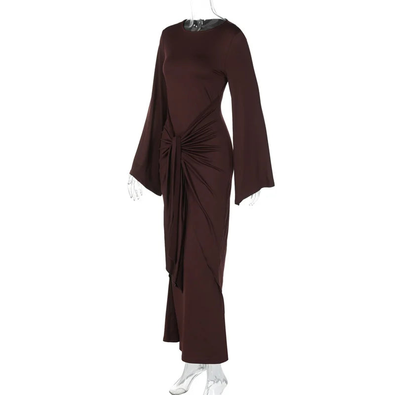 Brown evening gown with a draped design on a white background