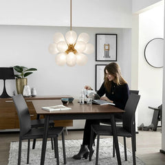 A cluster of White glass bubble LED pendant lights hanging from a ceiling, illuminating a modern study room. Golden Atelier 4