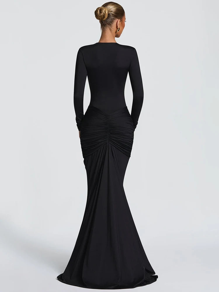 Black evening gown with long sleeves on a white background