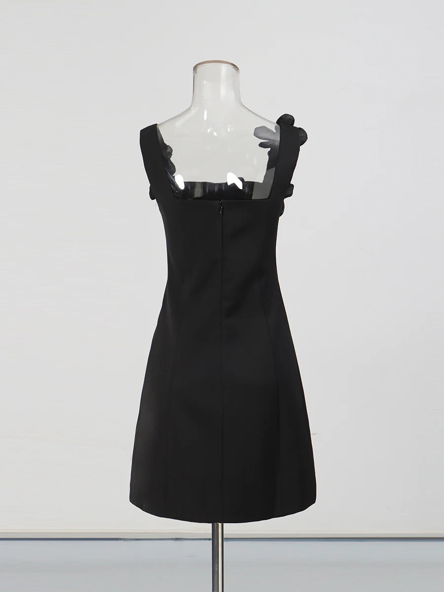 Black dress on a mannequin against a white background