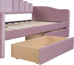 Pink twin upholstered daybed with drawers and USB ports.