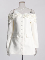 White jacket with floral embellishments on a mannequin against a white background