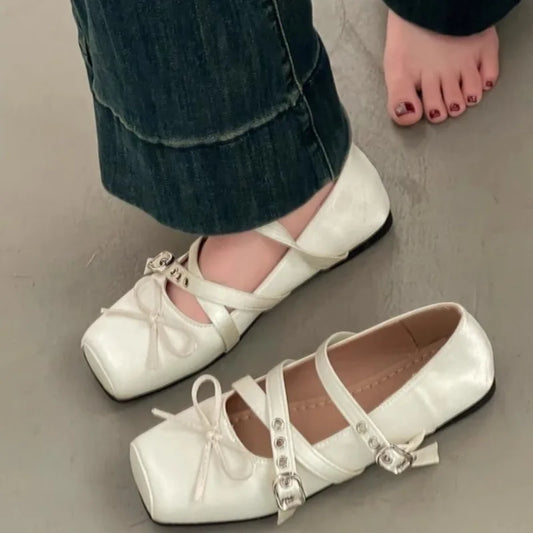 Square toe ballet flat in white with cross straps and buckle detail