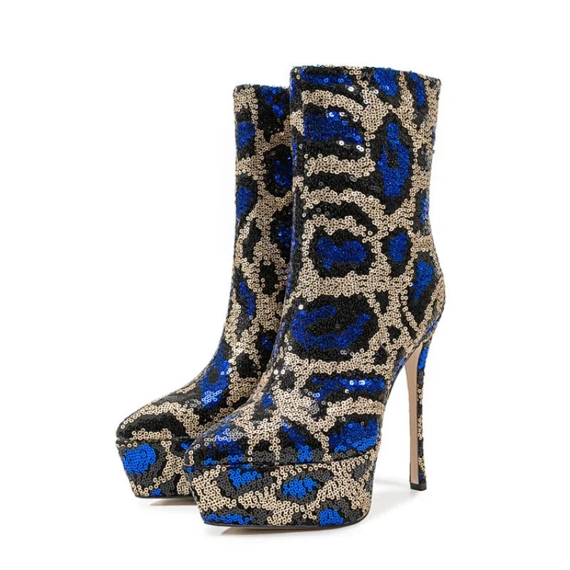 Blue and gold sequin platform boots on a white background
