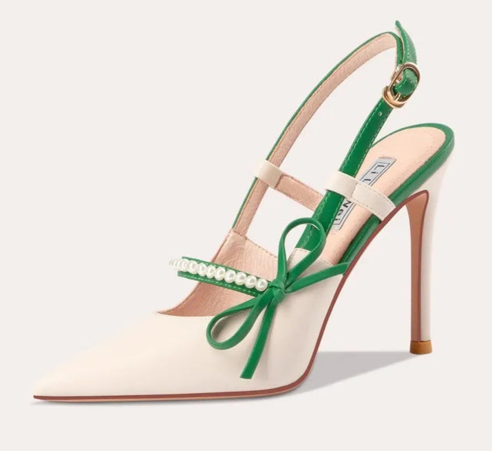 Green high-heeled sandal with bow detail on a white background