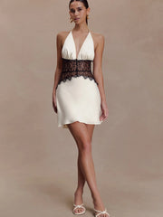 White halter neck mini dress with black lace trim
